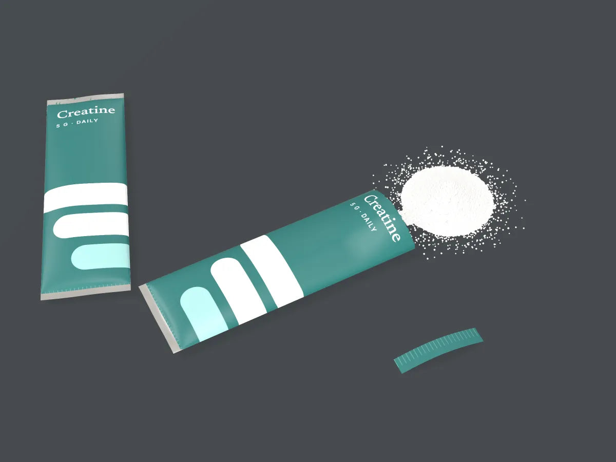 An open StackScience creatine stick with powder poured out beside a sealed stick